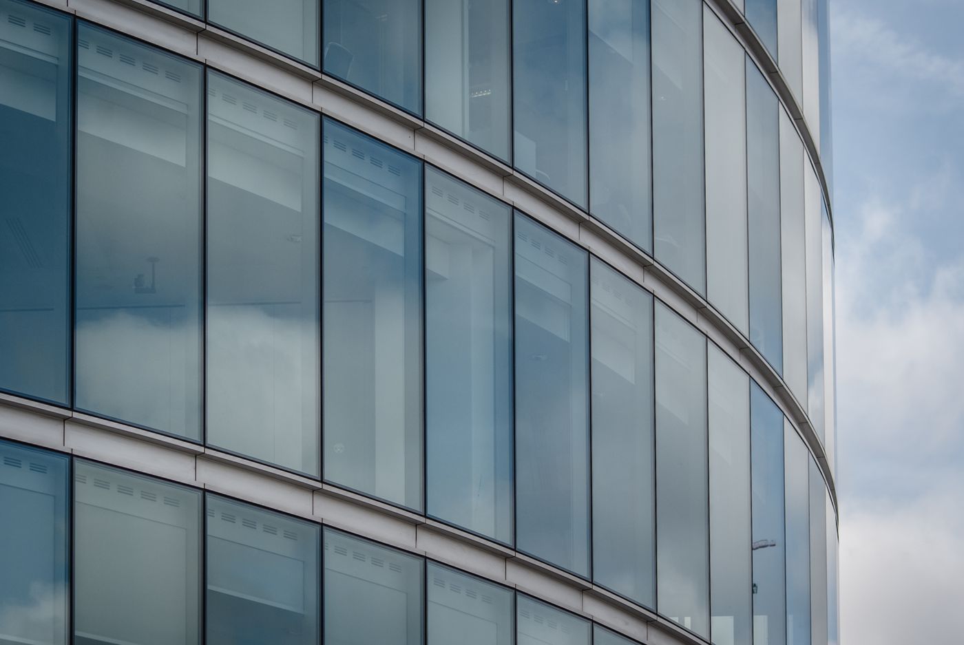 Large modern glass-fronted commercial building — illustrative stock photograph